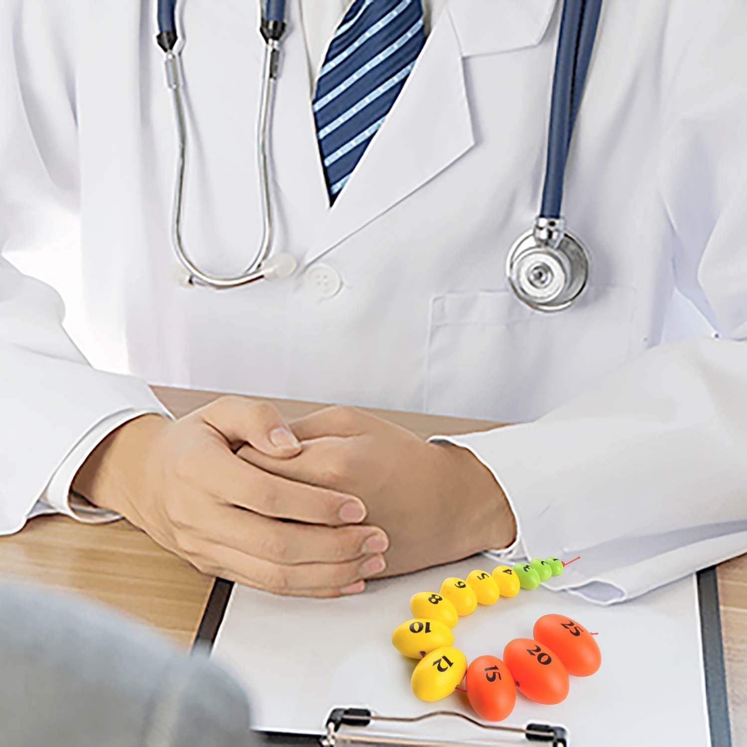 Medical Student Measuring Testicle Volume with Orchidometer