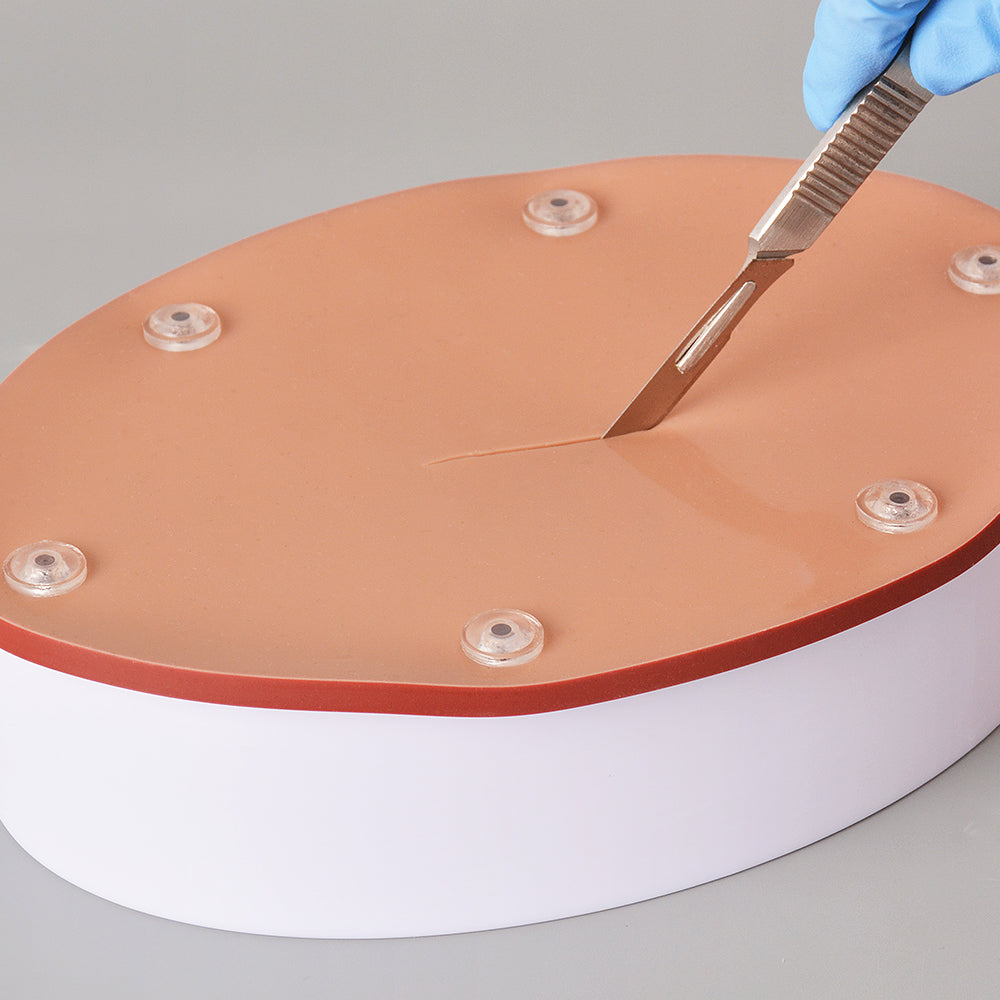 Medical Student Practicing Suturing On Hollow Organ Pad