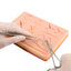 Medical Student Using Surgical Suture Training Pad