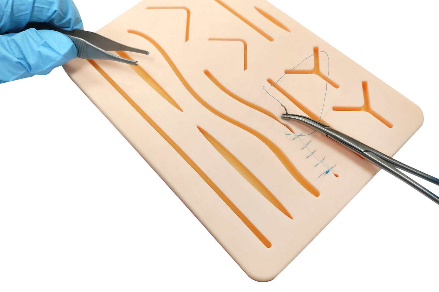 Pre-Cut Wounds on Suture Pad for Multiple Techniques